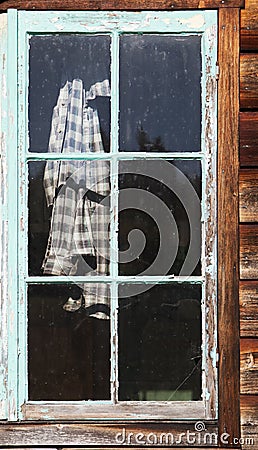 Plaid Shirt In Window Stock Photo