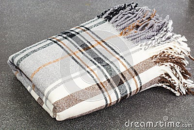 Plaid woolen in cage on gray background Stock Photo