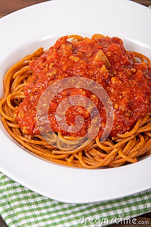 Plain cooked spaghetti pasta over a wood table Stock Photo