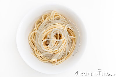 Plain cooked spaghetti pasta in white bowl, on white background. Stock Photo