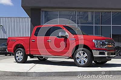 Ford F150 display at a dealership. The Ford F-150 is available in XL, XLT, Lariat, King Ranch, Platinum, and Limited models Editorial Stock Photo