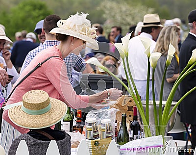 Women wearing hat at a tailgate party at horse race Editorial Stock Photo