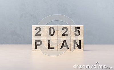 2025 plan on wooden cubes. Development success and motivation in 2025. Planning,opportunity, business strategy in new Stock Photo