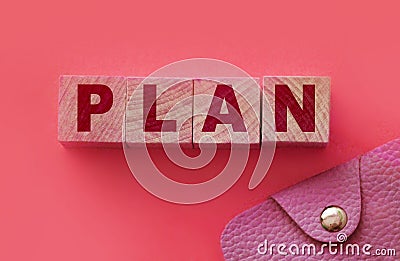 PLAN word made with building blocks on pink and small wallet. Financial planning finace management concept Stock Photo