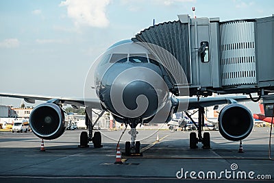 Plane on airport connected to gate sleeve Stock Photo