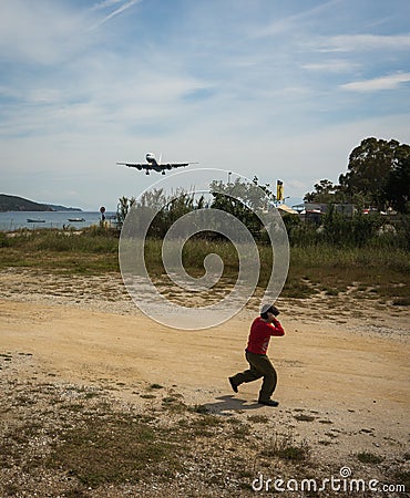 Plane coming in to land, Skiathos, Greece Editorial Stock Photo