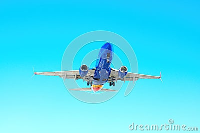 Plane Descending for Landing Seen from Below Stock Photo