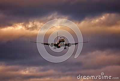 Plane on final approach with wheels down and dramatic sky, palma airport, mallorca, spain Stock Photo