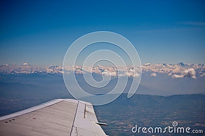 Plane flying next to the french alps Stock Photo