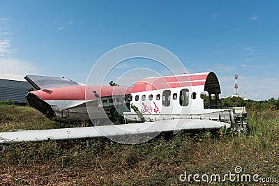 Plane fuselage wreckage sitting on the ground Stock Photo