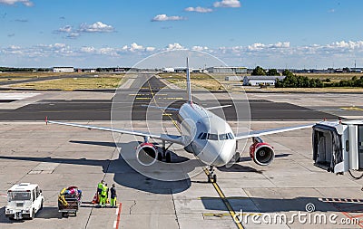 The plane landed at the airport Stock Photo