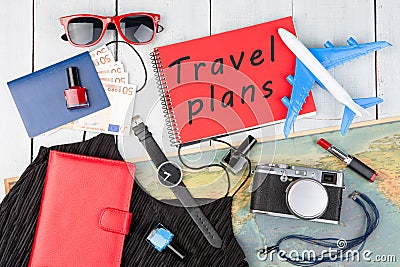 plane, map, passport, money, watch, camera, notepad with text & x22;T Stock Photo