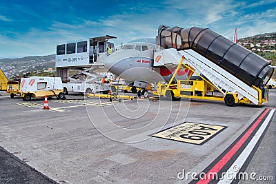 A plane owned by Jet2, the UK holiday travel business is serviced and refuelled ready for its next flight. Editorial Stock Photo