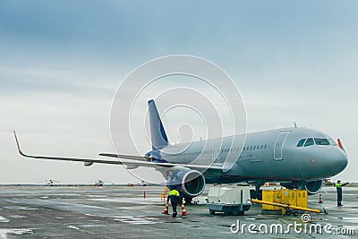 The plane in the parking lot at the airport Stock Photo