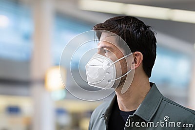 Plane Passenger In Airport Wearing Facemask Stock Photo