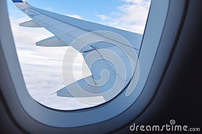 Plane passenger view on a wing with day time skies. Stock Photo