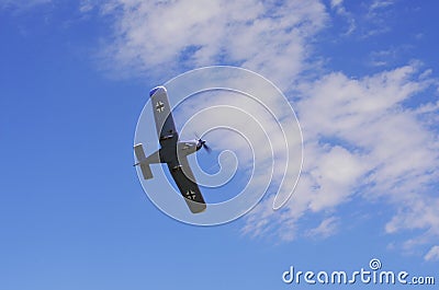 Plane performs aerobatics in the sky Stock Photo