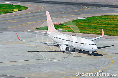 Plane on the taxing track left the airport view from above Stock Photo