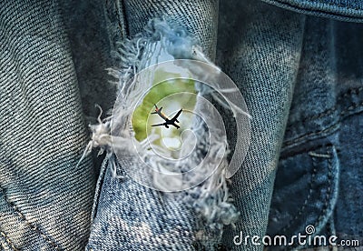 The plane from the view of the torn denim jacket Stock Photo