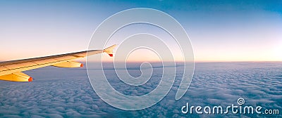 Plane wing over clouds Stock Photo