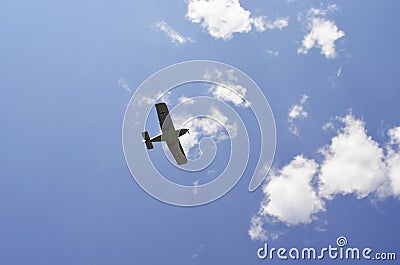 Plane performs aerobatics in the sky Stock Photo