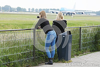 Plane spotters watching planes at Polderbaan, Amsterdam Airport Schiphol Editorial Stock Photo