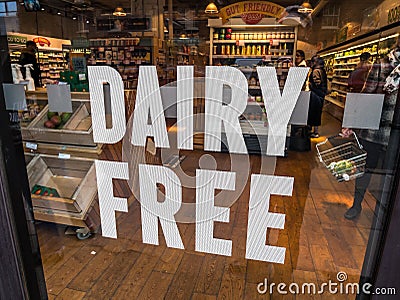 Planet Organic window sign for Dairy Free. Editorial Stock Photo