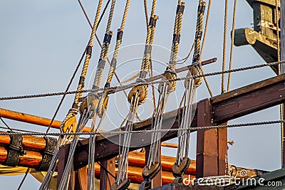 Planks, ropes, pulleys, tackle, and rigging of a replica of a 1400's era sailing ship Stock Photo