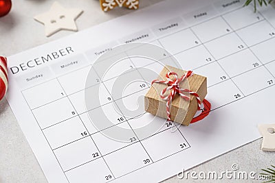 Planner page with Christmas gift box lying on 25th of December Stock Photo