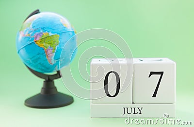 Planner wooden cube with numbers, 7 day of the month of July, summer Stock Photo