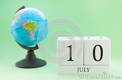 Planner wooden cube with numbers, 10 day of the month of July, summer Stock Photo