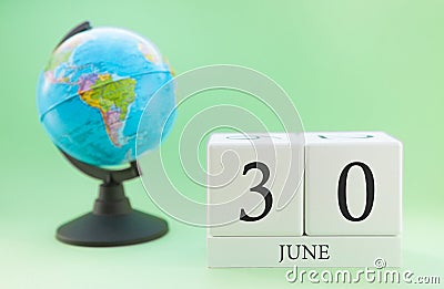 Planner wooden cube with numbers, 30 day of the month of June, summer Stock Photo