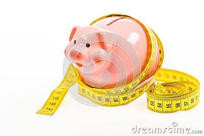 Planning budget. Business problem. Limited or restricted. Credit loan debt. Piggy bank and measuring tape. Budget limit Stock Photo