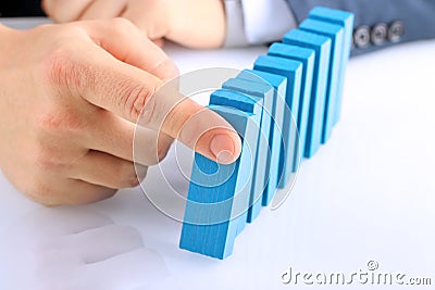 Planning, risk and strategy in business, businessman pushing wooden block Stock Photo