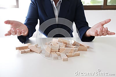 Planning risk and strategy in businessman gambling failure of wooden blocks stag. Business concept for growth and success process. Stock Photo