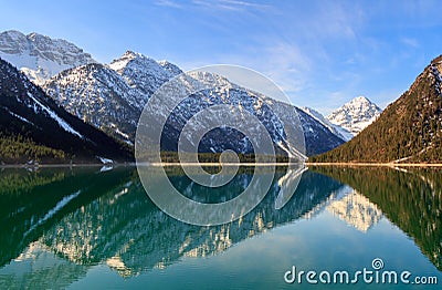 Plansee lake spring panorama with snow on mount top, Tyrol, Austria. Stock Photo