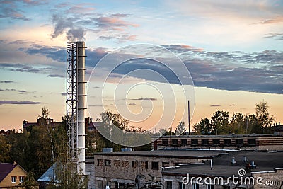 Pipe factory smoke in the background of a beautiful sky Stock Photo