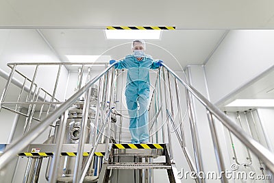 Plant picture, scientist standing on ladder Stock Photo