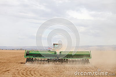 A farmer plants wheat in an Idaho farm field. Editorial Stock Photo