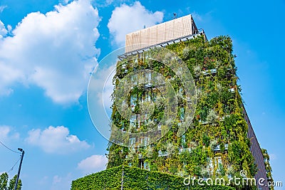 Plants living on a wall if a highrise building in Milano, Italy Editorial Stock Photo