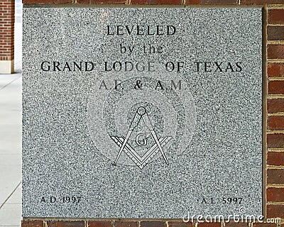 Plaque on City Hall in Grapevine Texas, `Leveled by the Grand Lodge of Texas`. Stock Photo