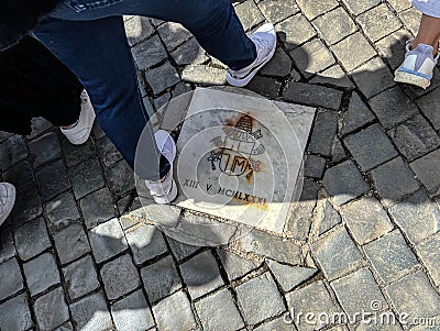 A plaque among the paving stones in St. Peter's Square in the Vatican commemorating the site of the assassination attempt Stock Photo