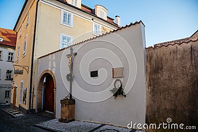 Plaque on wall of former cemetery at St. Jana in Obora, picturesque street Jansky vrsek with baroque and renaissance historical Editorial Stock Photo