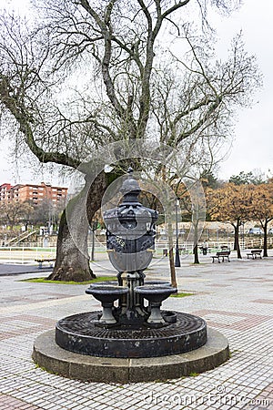 Old iron fountain with four pipes in the Coronation Park Editorial Stock Photo