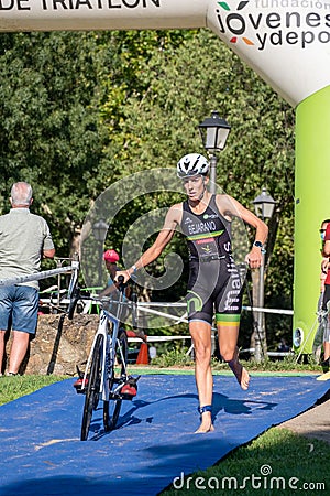 Fitness athletes pedaling their bikes during a national Triathlon, swimming, cycling and running events. Editorial Stock Photo