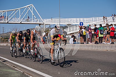 Fitness athletes pedaling their bikes during a national Triathlon, swimming, cycling and running events. Editorial Stock Photo