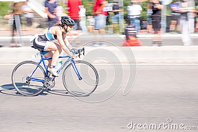 Fitness athletes pedaling their bikes during a national Triathlon, swimming, cycling and running events. Editorial Stock Photo