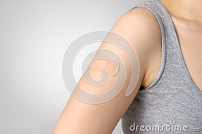Plaster on female arm Stock Photo