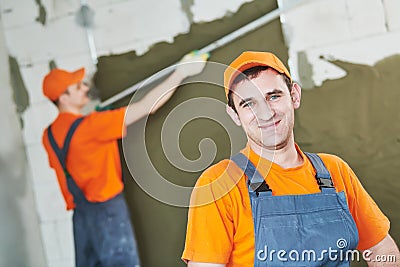 Plaster service. portrait of male plasterer Stock Photo