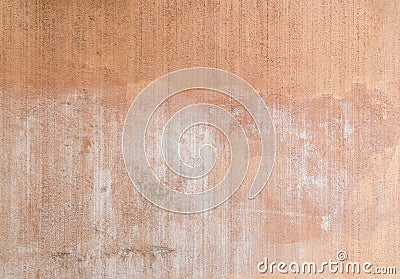 Plastered, painted and faded peachy wall background Stock Photo